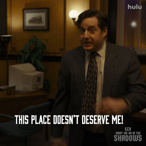 Man in a suit and tie saying, "this place doesn't deserve me!"