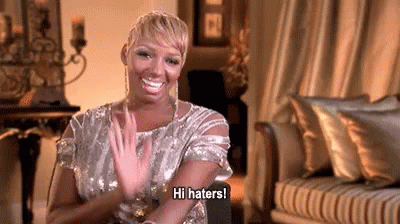 Nina Leakes saying "hi haters!" and blowing a kiss